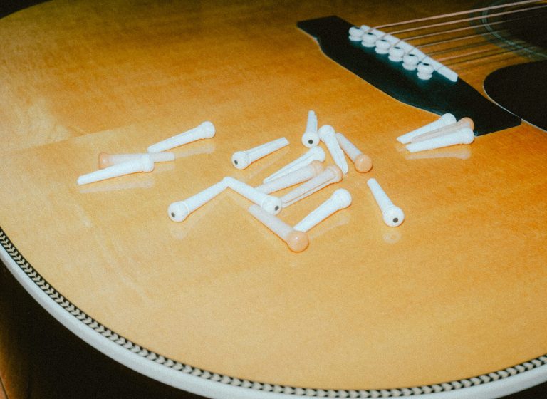 Do Bridge Pins Matter? How Bridge Pins Affect your Tone